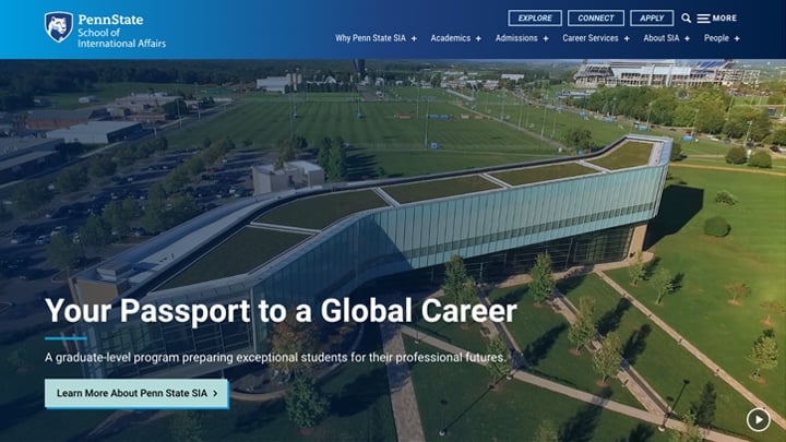 Screenshot of the Penn State School of International Affairs website with a background of aerial drone footage of the Law School Katz Building